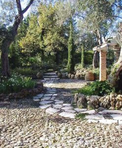 A stone walkway can create a good flow for your backyard