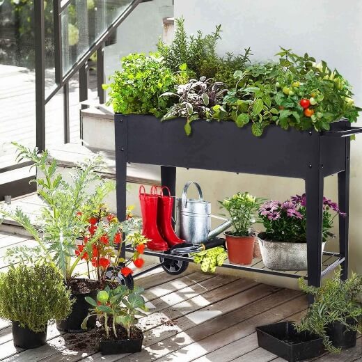 FOYUEE Raised Balcony Planter Box on Wheels can be rolled around the balcony, or even rolled indoors for winter if you’re growing tender crops, or plants