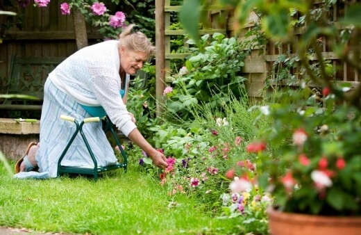 A woman using garden knee pads