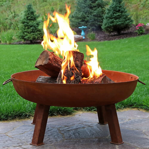 Sunnydaze Cast Iron Outdoor Fire Pit Bowl glows an almost molten red when the flame gets going and radiates heat around the patio