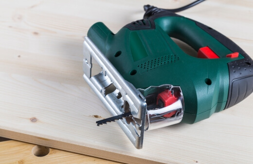 Jigsaw is a power saw that employs a reciprocating blade to cut curves and irregular forms in wood, metal, or other materials