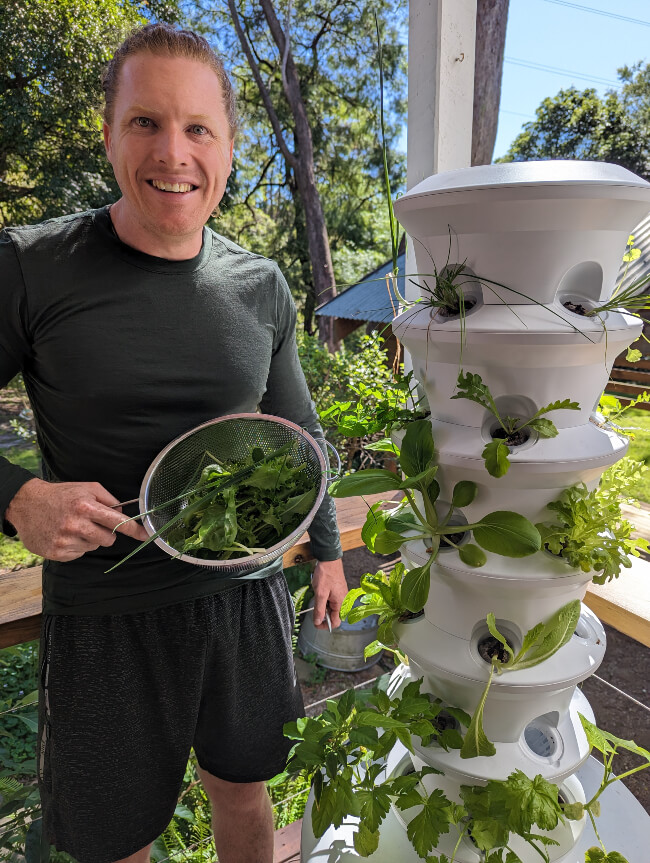 Nathan with some fresh harvest from his Airgarden