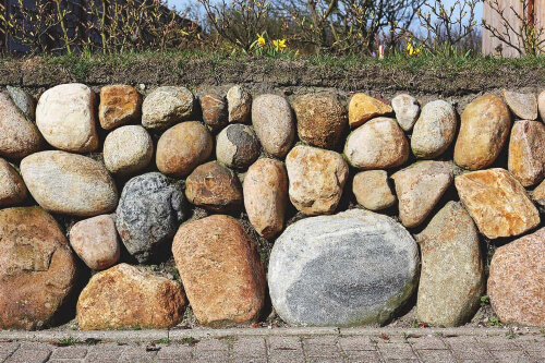 Stone fencing creates a rustic and natural charm