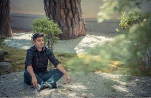 A man in a meditation garden